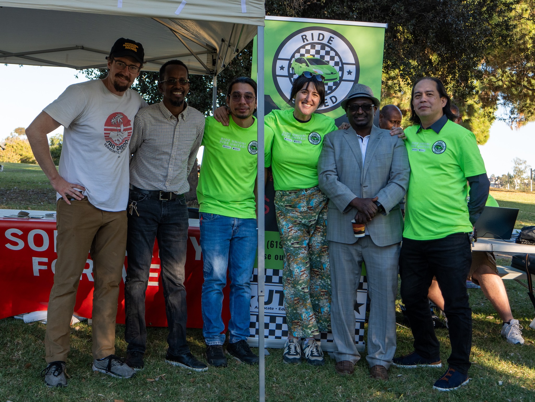 Photograph of Ride United volunteers and United Taxi Workers staff at the app launch in December 2022. 